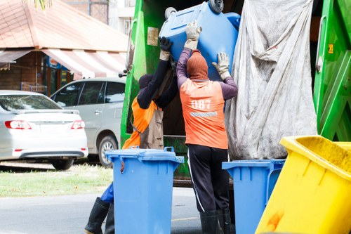 Workers segregating construction waste on-site